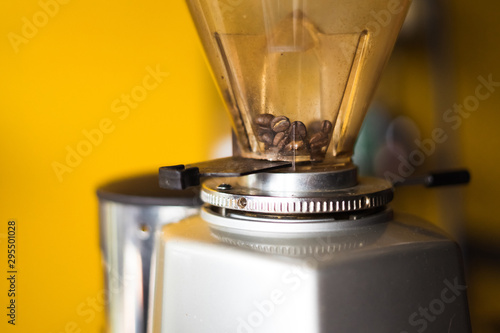 Wallpaper Mural close-up fresh in coffee grinder prepare to mill , tool and machine background blur Torontodigital.ca