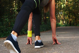Feet step runner on the road, closeup shoes. Start running on the sidelines. Run outdoor exercise activity concept.