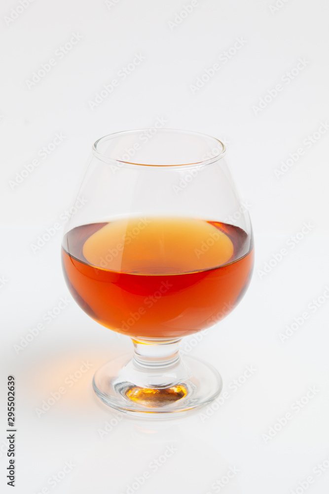 whiskey in a glass on a white background whiskey in a glass on a white background