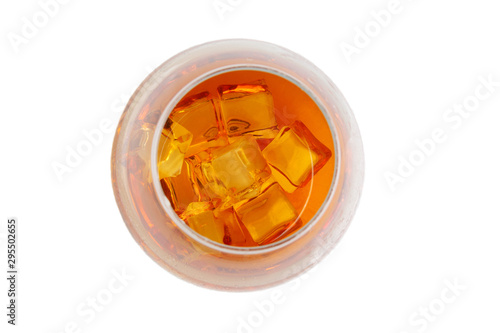 ice cubes in a glass with whiskey. top view on a white background