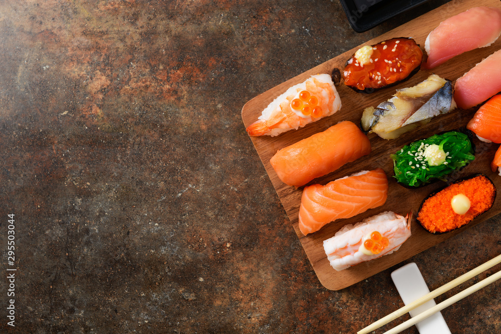 close up of sashimi sushi set with chopsticks