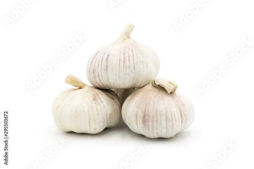 3 whole fresh garlic close-up isolated on white background