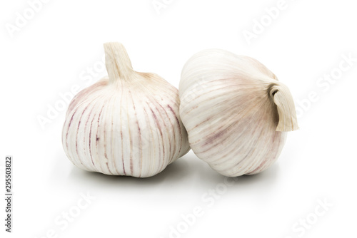 2 whole fresh garlic close-up isolated on white background