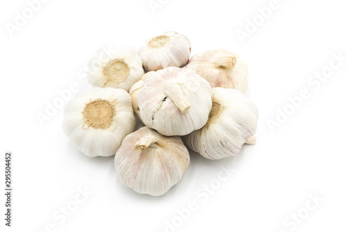 Stacked garlic roots closeup isolated on white background