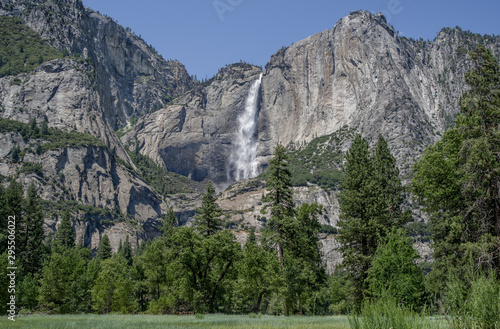 Yosemite Falls in July: Water from melting snow cascades over a cliff to form the highest waterfall in Yosemite National Park and one of the highest in North America.