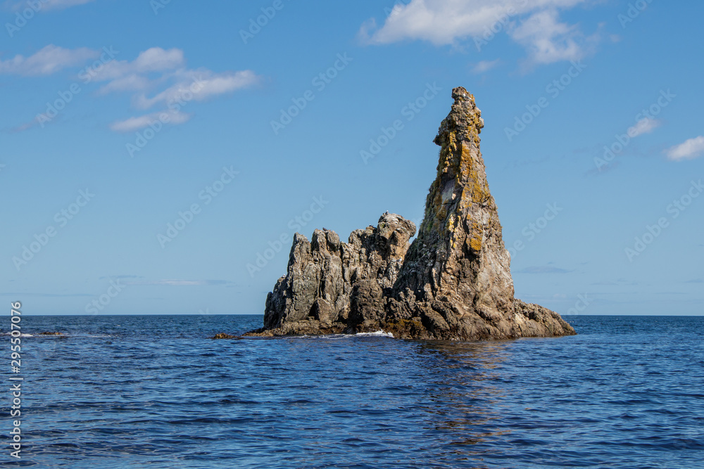 A beautiful rock formation like castle near the coast of the Sea of Okhotsk. Island Sakhalin, Russia A beautiful rock formation like castle near the coast of the Sea of Okhotsk. Island Sakhalin, Russia