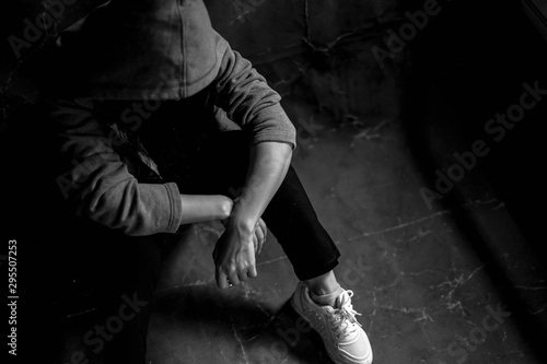 Drugged woman sitting on the floor with substance abuse, substance abuse, addiction, people and drug use concept, copy space background for text.