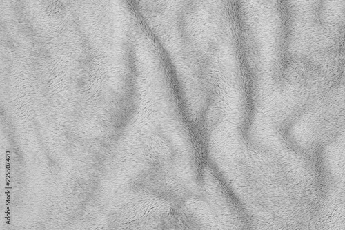 Crumpled seamless texture of a terry towel. Gray color