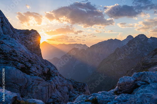 Sun Beam over Purple Mountains in the Alps