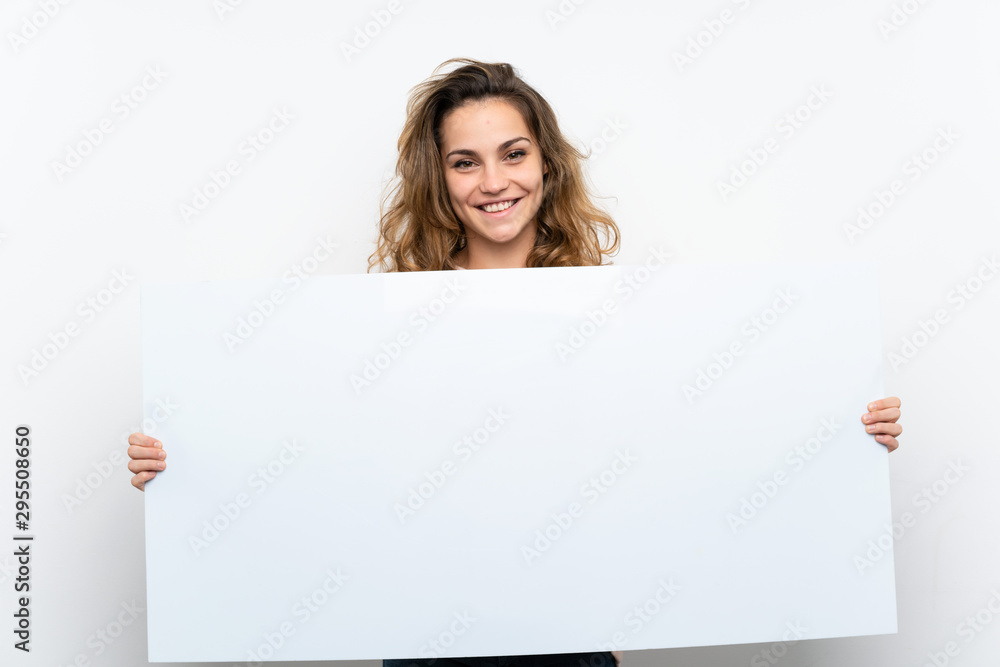 Young blonde woman holding an empty white placard for insert a concept Young blonde woman holding an empty white placard for insert a concept