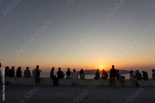 People watching the famous sunset in Santorini