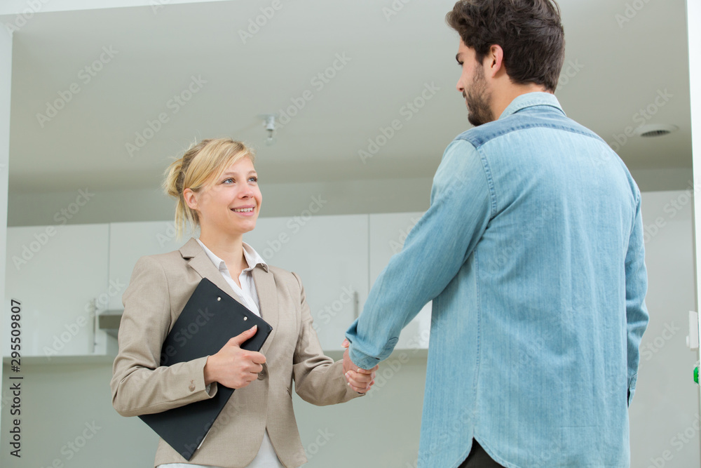 Fototapeta premium portrait of woman showing an apartment