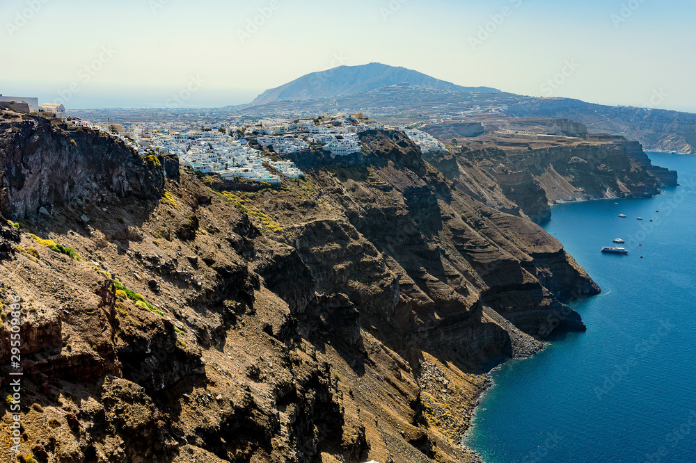 City of Oia in Santorini on the mountain cliffs with sea view