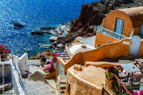 Stairway to the Amoudi Ammoudi bay with traditional houses of Santorini Oia photo