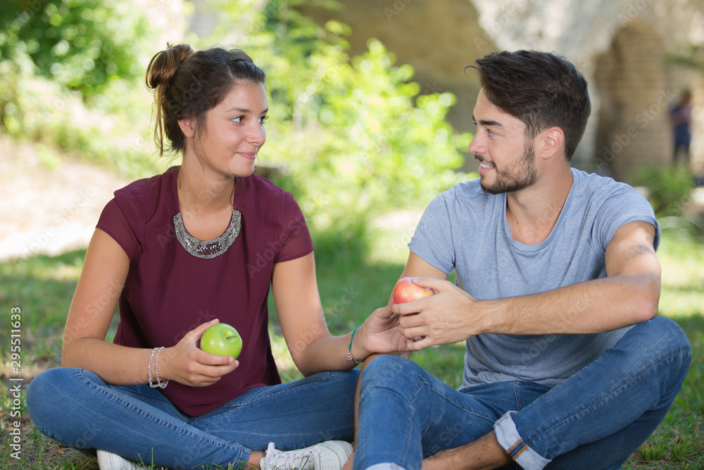 a couple of lovers holding apples a couple of lovers holding apples