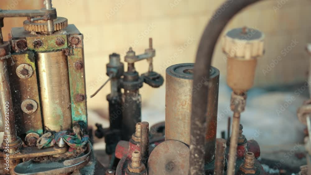 many old scrap, faulty, rusted mechanism, old machine from the factory, gears, which are a lot of rubber belts, slow motion, close up many old scrap, faulty, rusted mechanism, old machine from the factory, gears, which are a lot of rubber belts, slow motion, close up