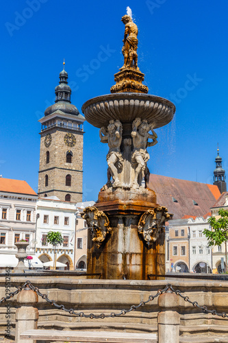 Main square with Samson fighting the lion fountain sculpture and bell tower in Ceske Budejovice. Czech Republic.