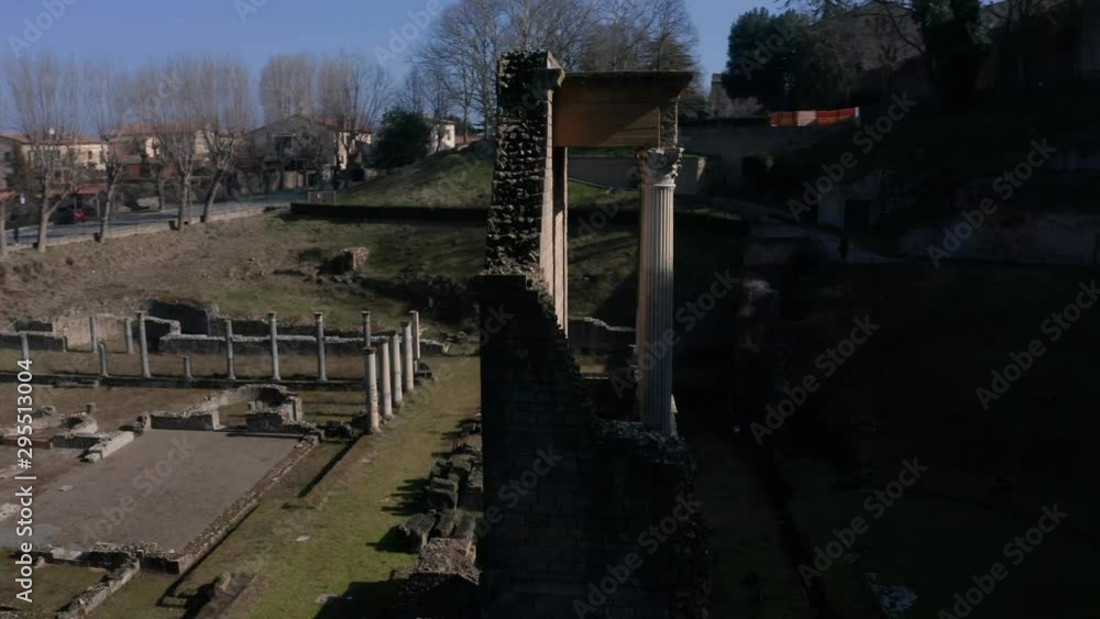 Drone circling old ruins of ancient Roman Theatre in Volterra, Tuscany, Italy