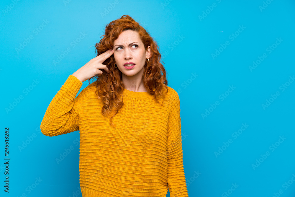 Redhead woman with yellow sweater with problems making suicide gesture Redhead woman with yellow sweater with problems making suicide gesture