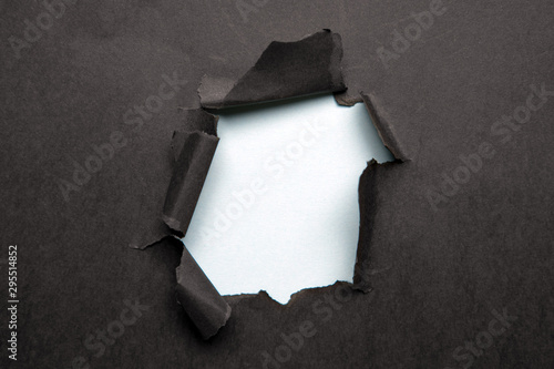 black Hole in the paper with torn sides.