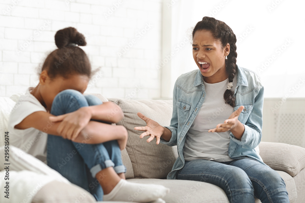 Girl shouting at younger sister, fighting at home Girl shouting at younger sister, fighting at home