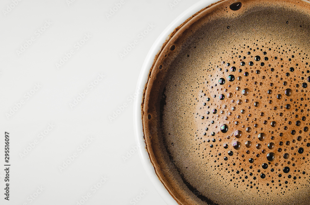 Top view of a cup of coffee. Coffee foam isolated on white background with clipping path.