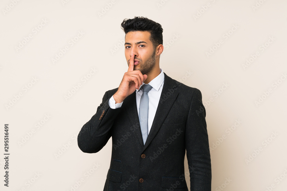 Young handsome businessman man over isolated background doing silence gesture Young handsome businessman man over isolated background doing silence gesture