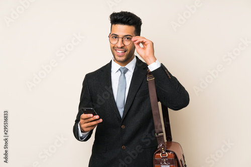 Young handsome businessman man over isolated background