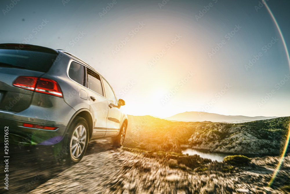 SUV car in spain mountain landscape road at sunset - obrazy, fototapety, plakaty 