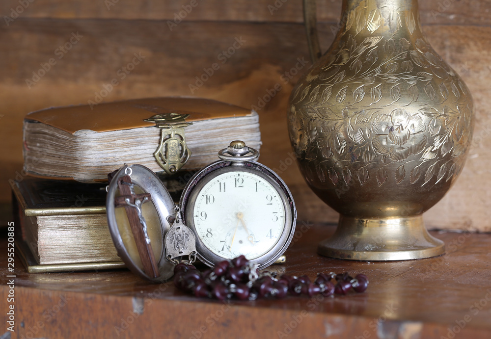 ancient bibles with pocket watch. Stock Photo Adobe Stock
