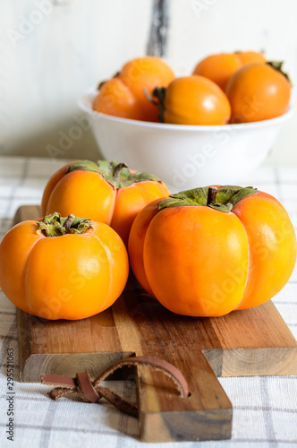  ripe persimmon fruit, isolated on white background