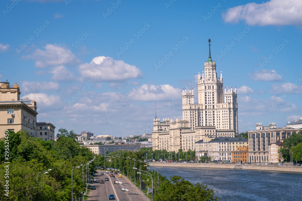 Moscow view with Kotelnicheskaya high rise building and Moscow river on sunny summer day.