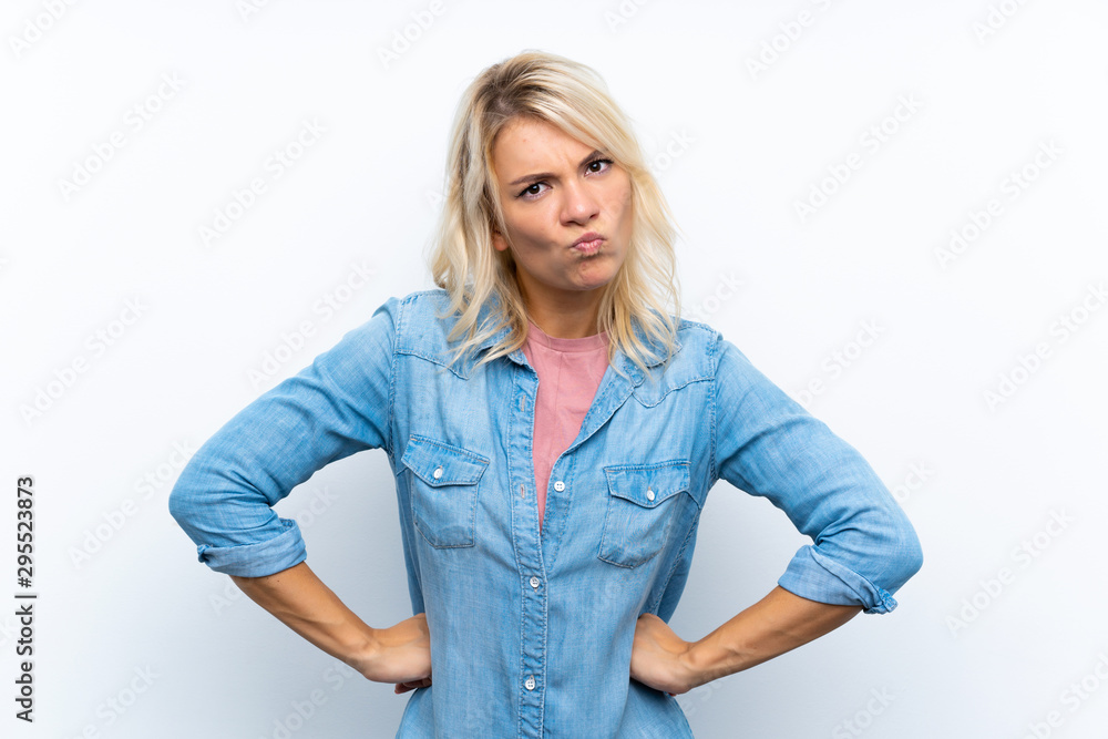 Young blonde woman over isolated white background angry Young blonde woman over isolated white background angry