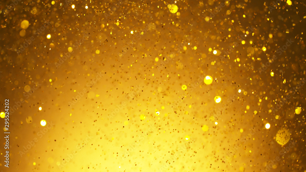 Abstract golden glittering background with blur dots. Abstract golden glittering background with blur dots.
