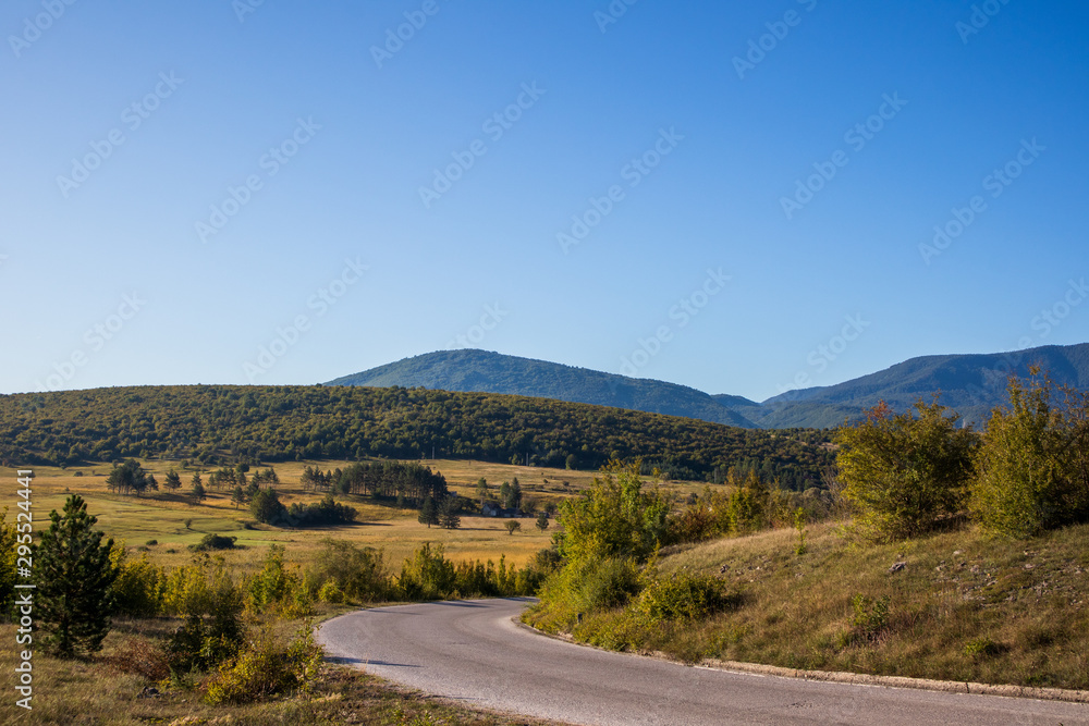 Asphalt road through hills and mountains near the Drvar in Bosnia and Herzegovina