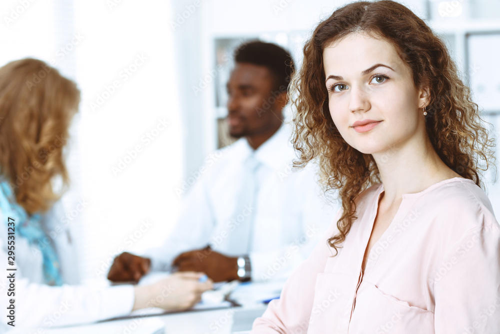 Business woman at meeting in office, colored in white. Multi ethnic business people group Business woman at meeting in office, colored in white. Multi ethnic business people group