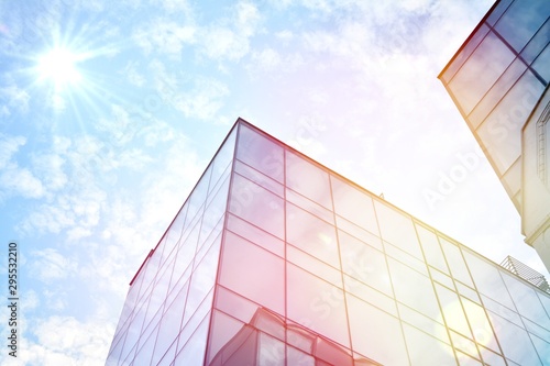 Modern office building detail  glass surface with sunlight