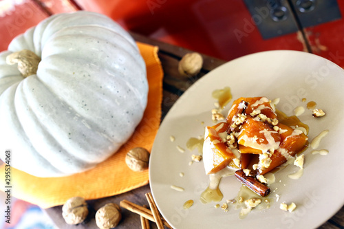 pumpkin dessert with raw pumpkin next to it autumn seasonal dish