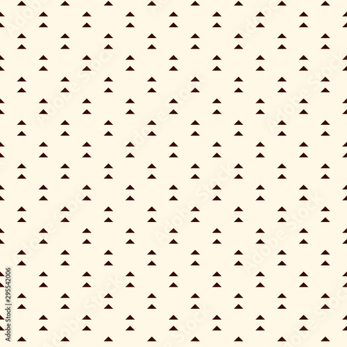 Repeated mini triangles on white background. Simple abstract wallpaper. Seamless pattern design with geometric figures.