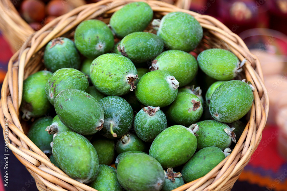 Green feijoa fruits laying in the basket at the market in Tbilisi Georgia. Green feijoa fruits laying in the basket at the market in Tbilisi Georgia.