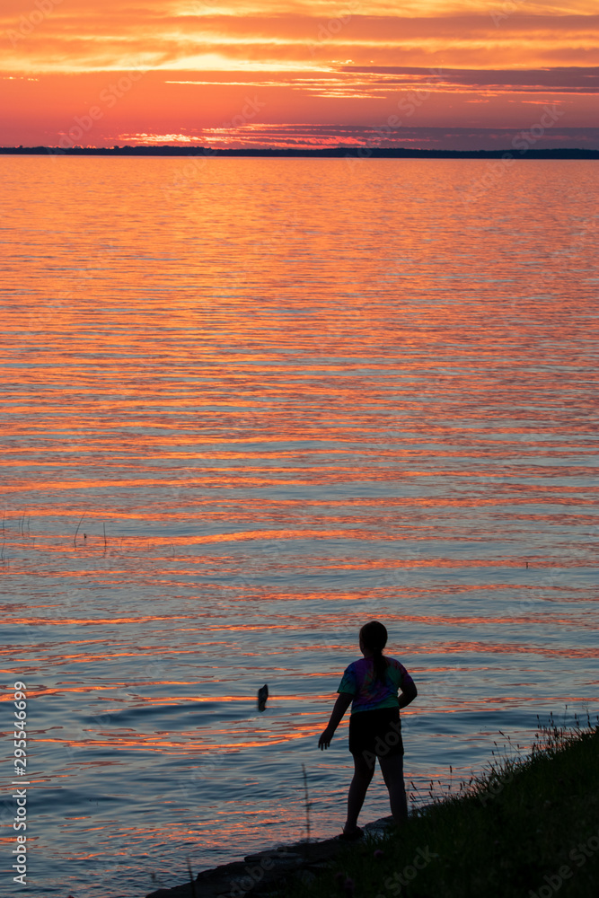 silhouette at sunset Lake Ontario