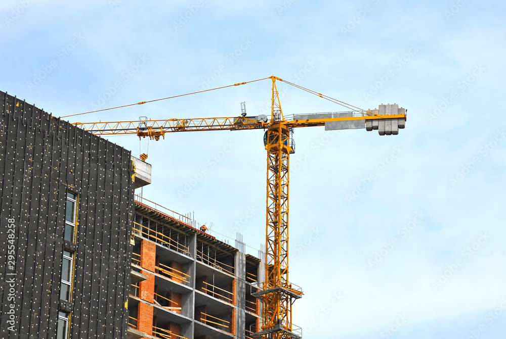 Crane and highrise construction site