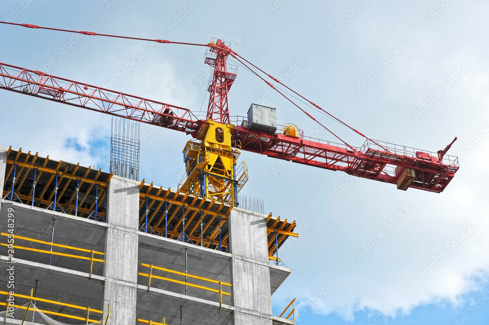 Crane and highrise construction site Crane and highrise construction site