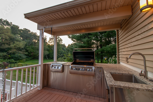outdoor kitchen; grill, sink, granite countertop