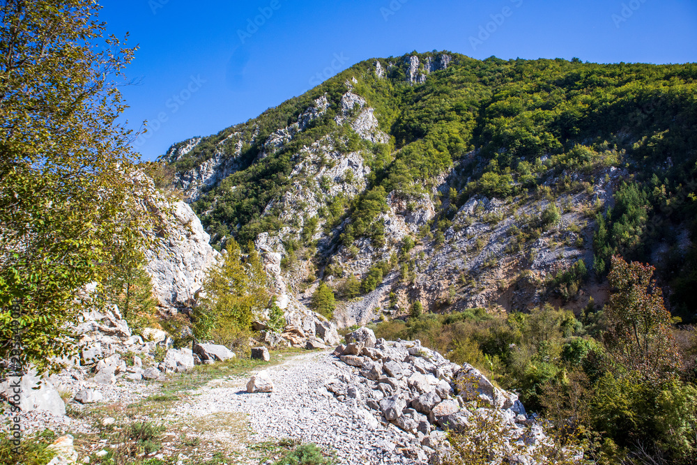 Footpath next to the rocks and mountains and Una river in village Martin Brod in Bosnia and Herzegovina