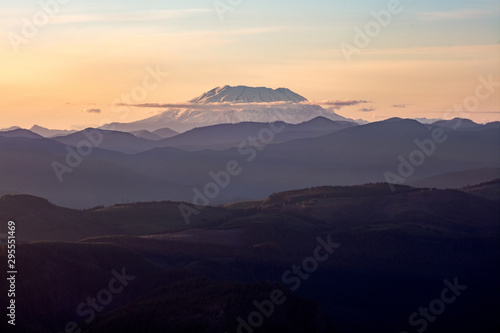 Mount St. Helens  active stratovolcano in Skamania County  Washington. Panoramic View from Sherrard Point  Fire Lookout at the top of Larch Mountain  Oregon. Sunset  Orange Sky  Mountain Silhouette