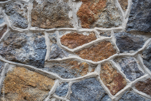 Textured stone background. Fragment of the wall