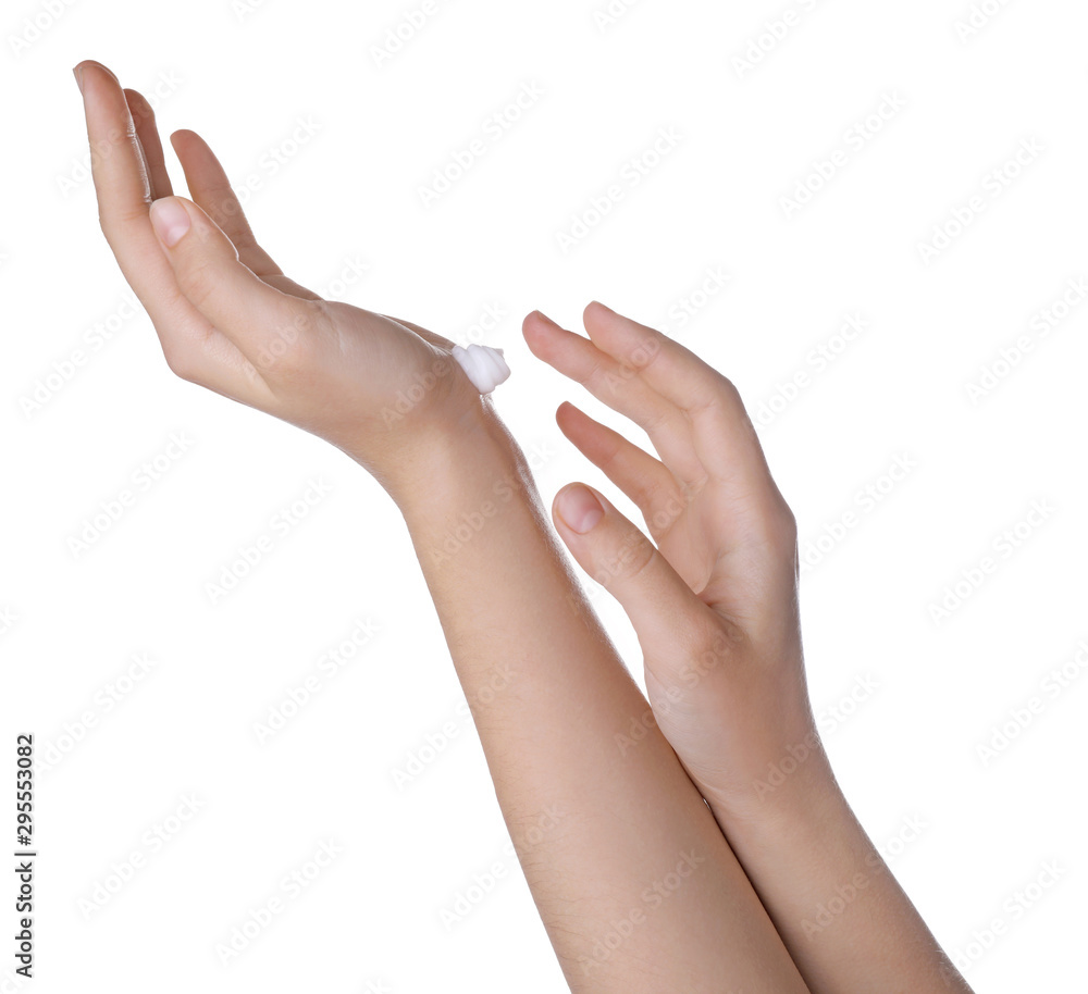 Young woman applying hand cream isolated on white, closeup
