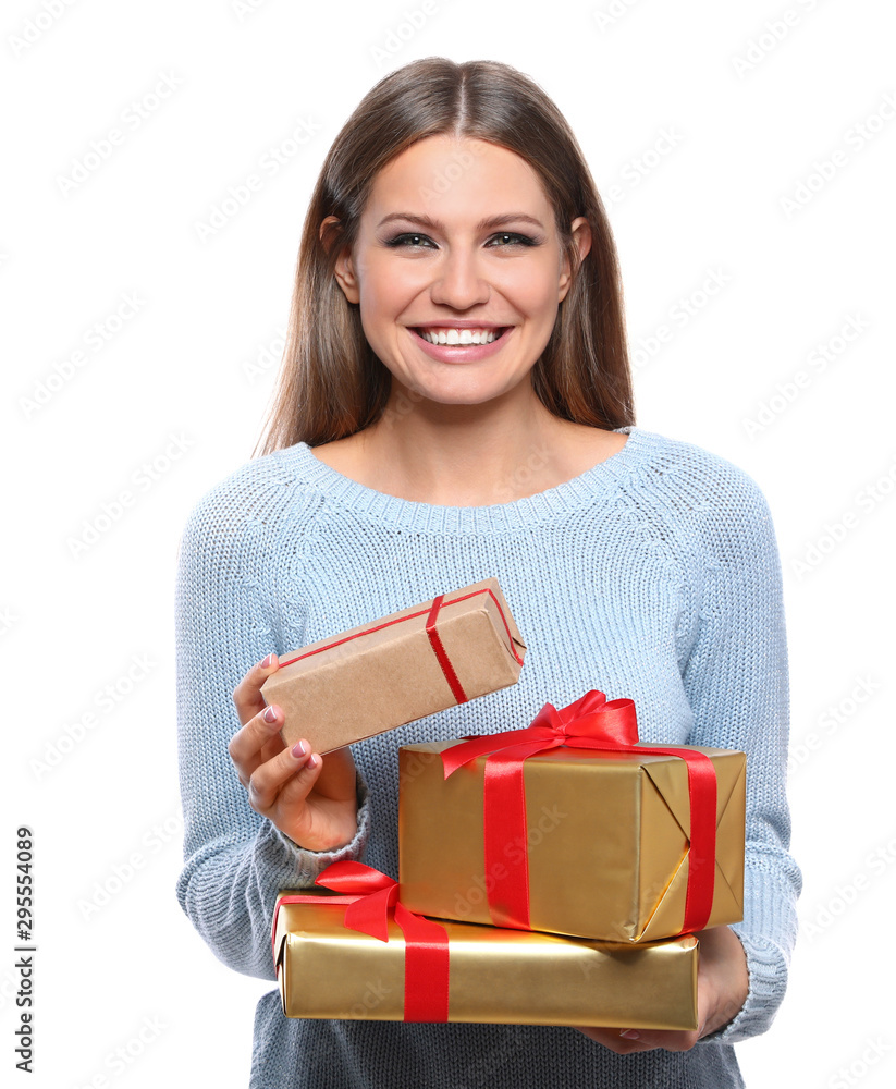 Young woman with Christmas gifts on white background Young woman with Christmas gifts on white background
