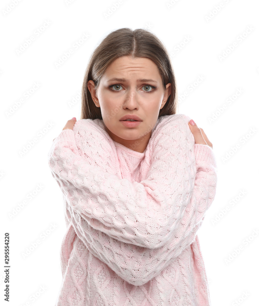 Young woman suffering from cold on white background